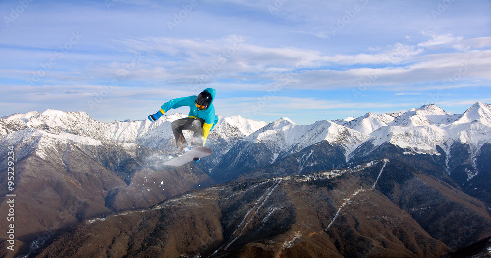 Obraz premium Flying snowboarder on mountains, extreme sport