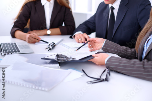 Group of business people at a meeting against the background of the office