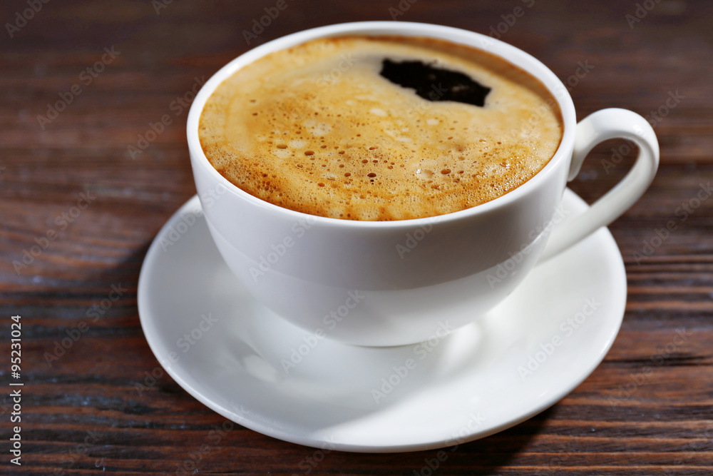 Cup of coffee on wooden background Cup of coffee on wooden background