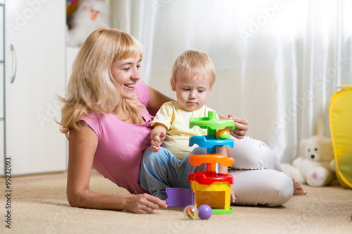 mother and her child playin...