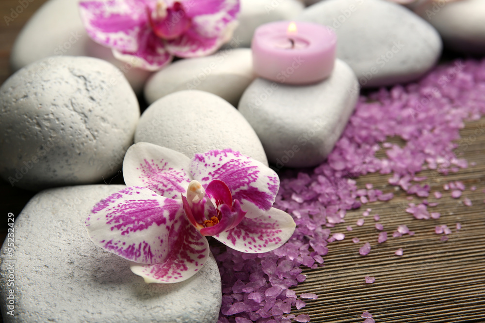 Spa stones with candles and salt closeup Spa stones with candles and salt closeup