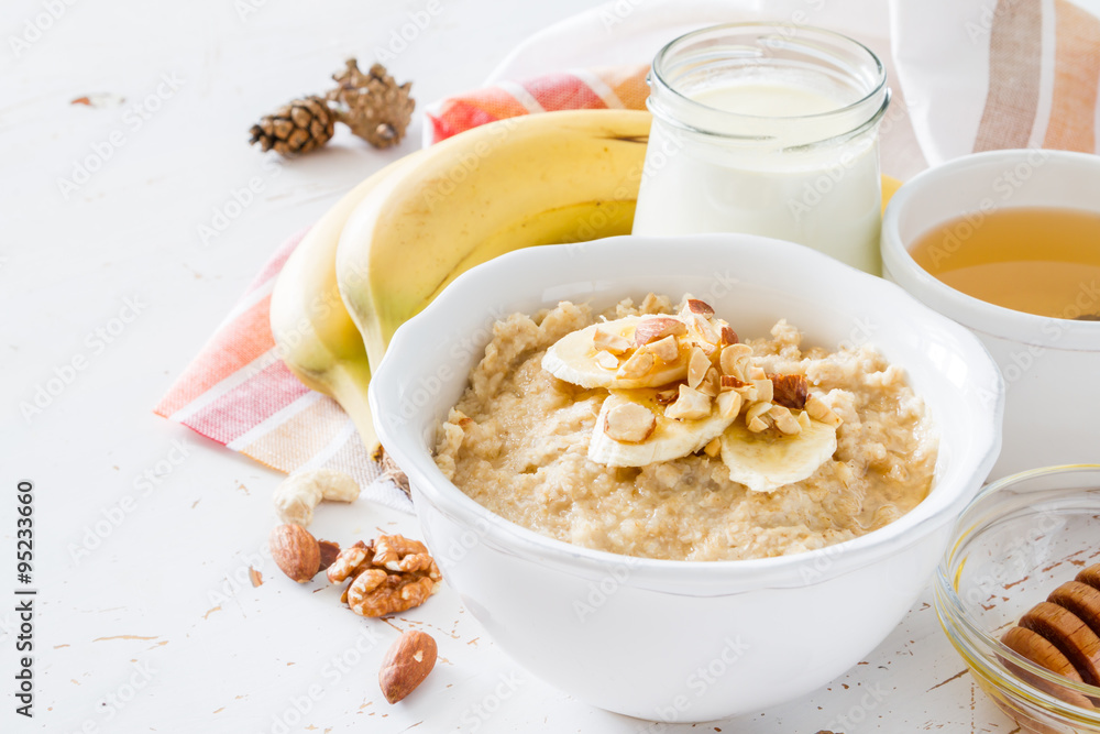 Autumn oatmeal in white bowl banana honey Autumn oatmeal in white bowl banana honey
