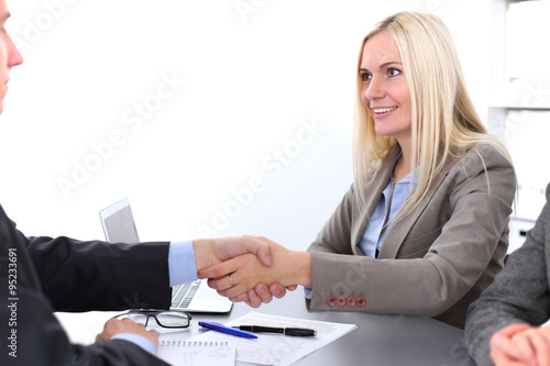 Business people shaking hands, finishing up a meeting