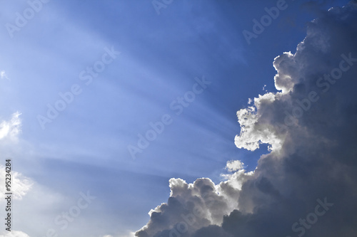 Sun rays through a cloud photo