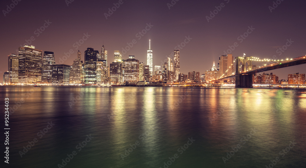 Vintage toned Manhattan waterfront at night, NYC, USA.