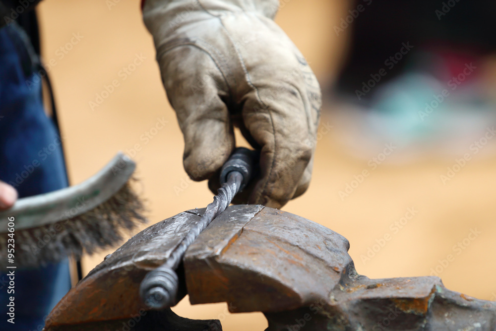 Closeup of blacksmith hand brushed metal forged products outdoor