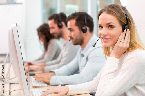 Young attractive woman working in a call center