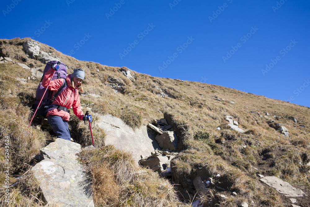 Fototapeta premium The girl with the backpack.