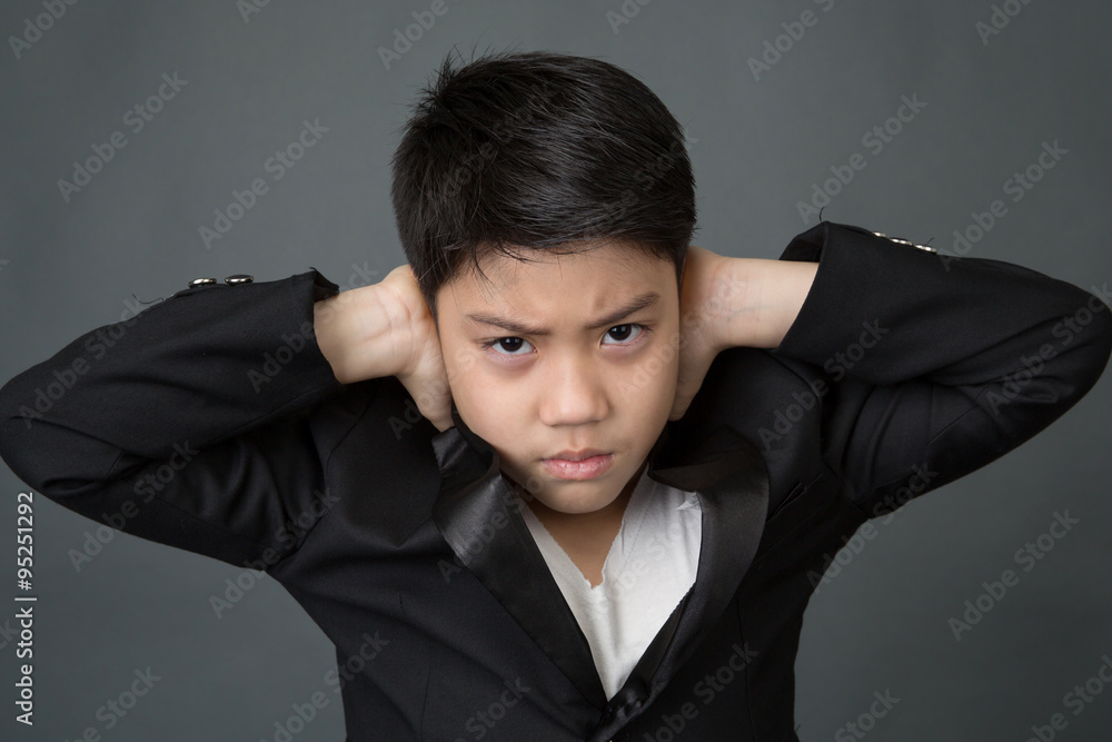 Little asian boy in black suit upset, depression face Little asian boy in black suit upset, depression face