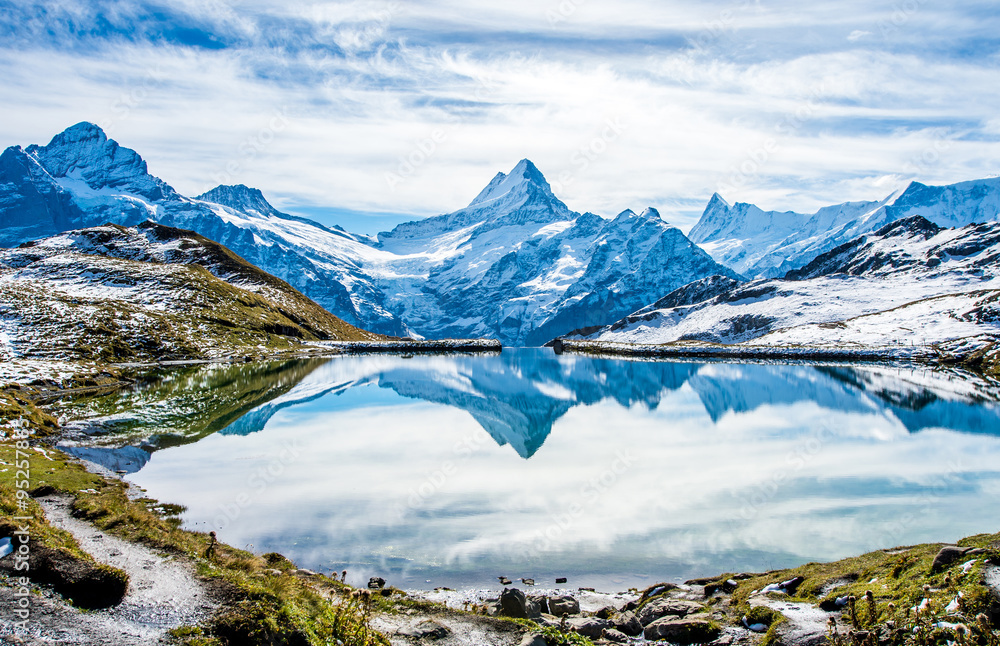 Obraz premium Swiss alps water reflection in Bachalpsee - mountain lake above Grindelwald, Switzerland.