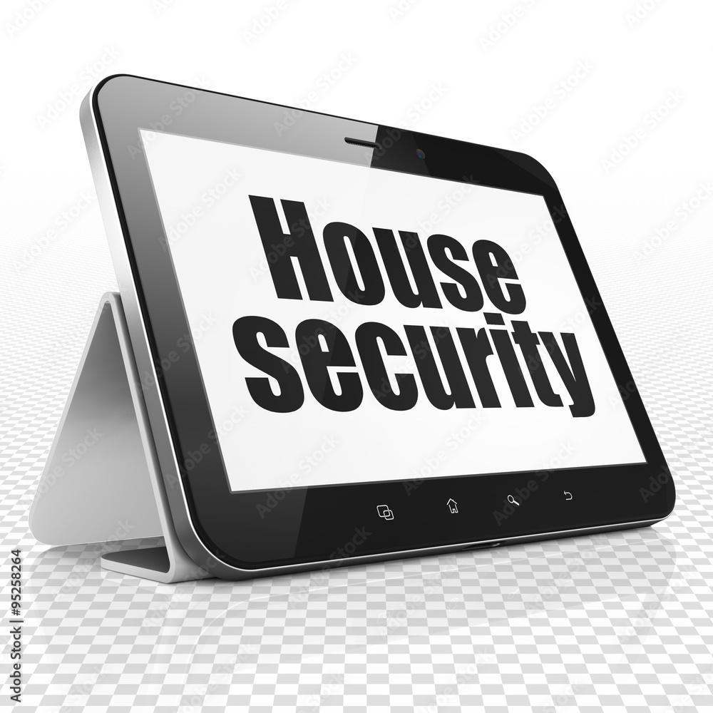 Safety concept: Tablet Computer with House Security on display Safety concept: Tablet Computer with House Security on display
