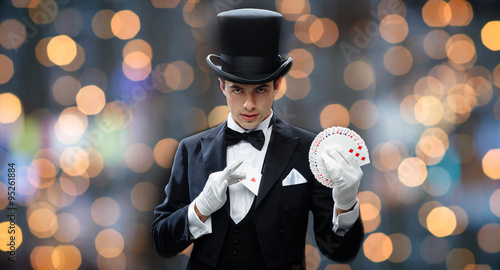 magician showing trick with playing cards