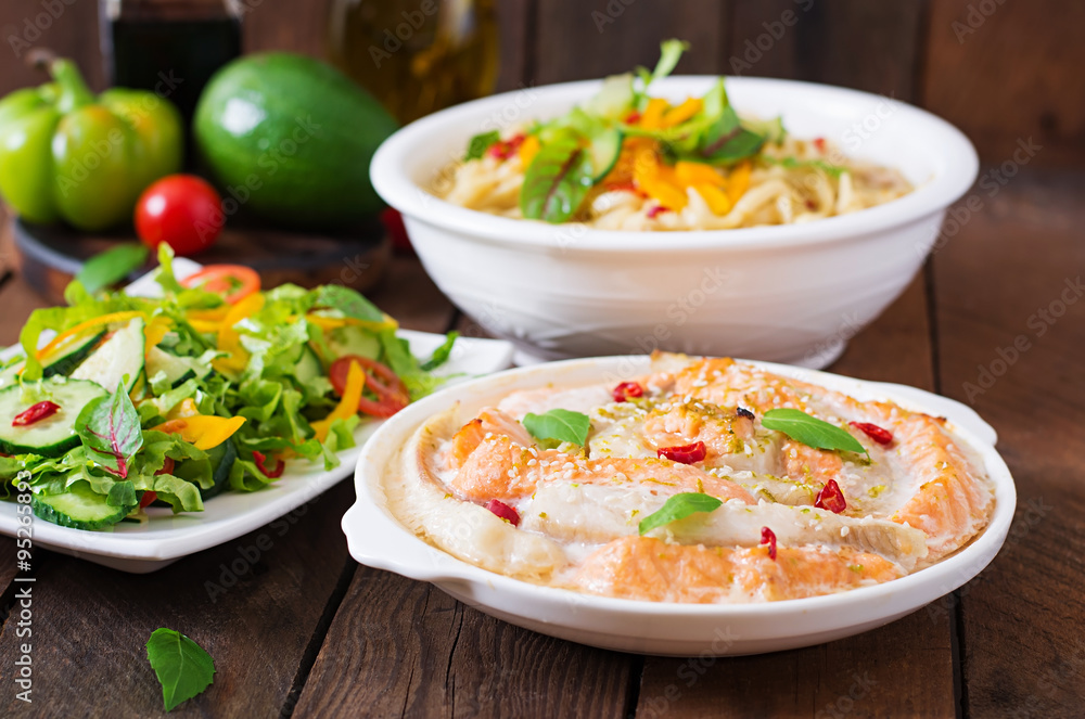 Baked slices of red and white fish with honey and lime juice, served with fresh salad and soft noodles in miso broth. Baked slices of red and white fish with honey and lime juice, served with fresh salad and soft noodles in miso broth.