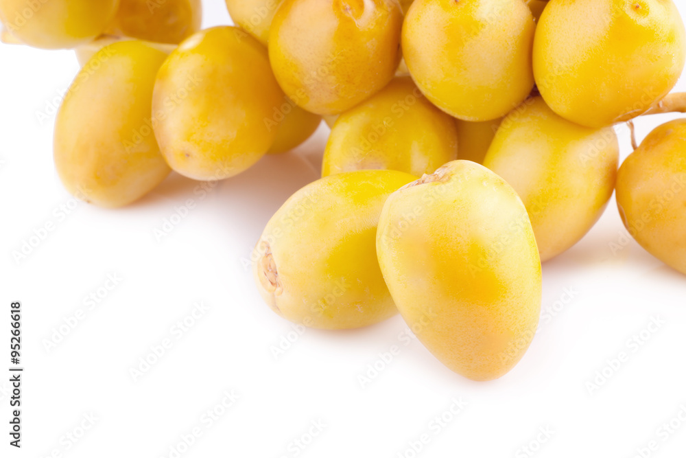 yellow raw dates isolated on white background