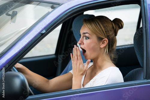 Shocked Woman Driving Car