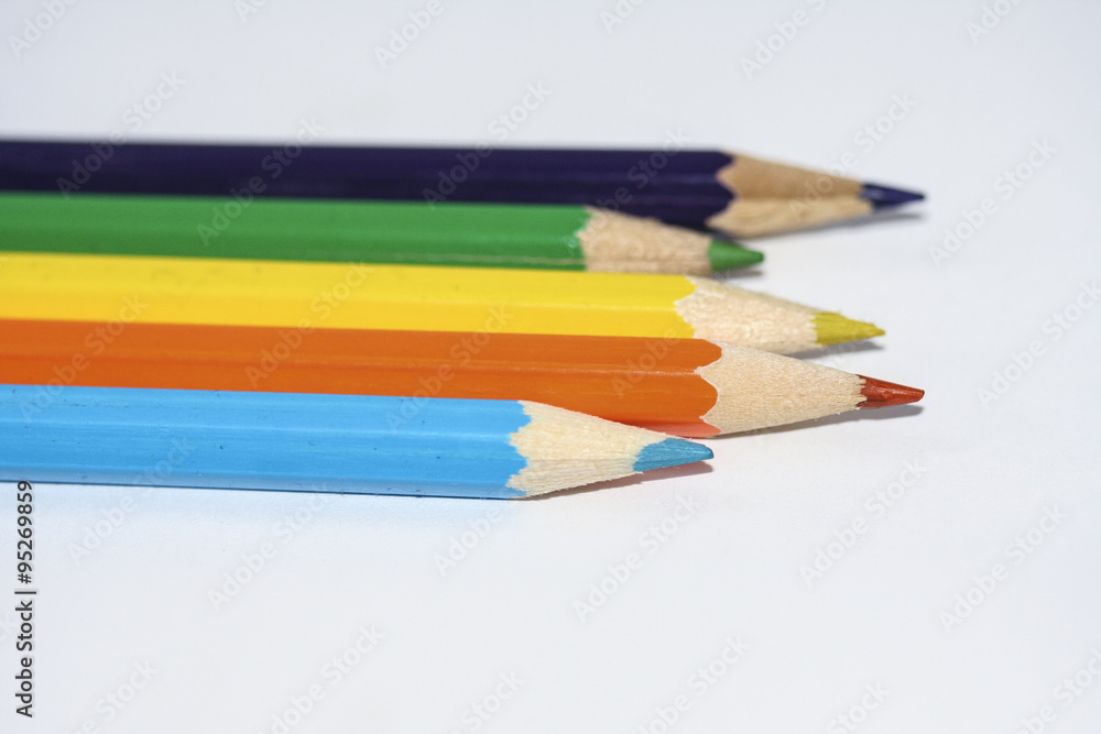 Row of coloured wooden pencils. Row of coloured wooden pencils.