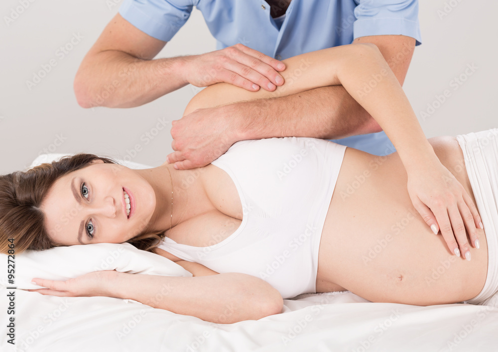 Fototapeta premium Pregnant woman at the physiotherapist
