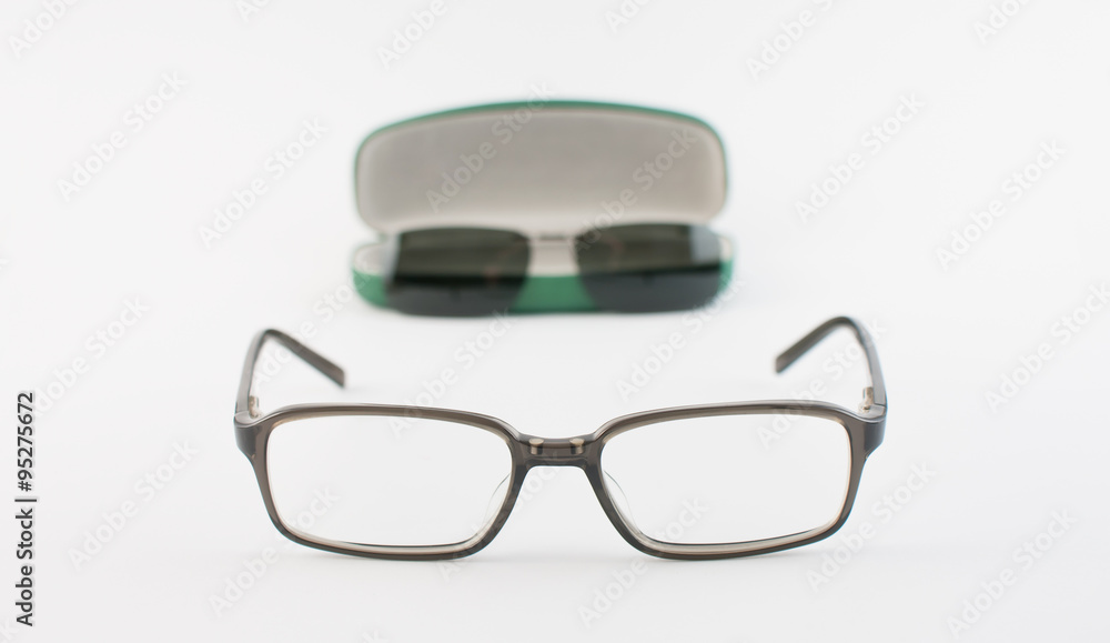 Glasses with sunglasses magnetic clip next to its case Glasses with sunglasses magnetic clip next to its case