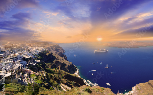 Panoramic view of a beautiful sunset over Santorini village in Greece
