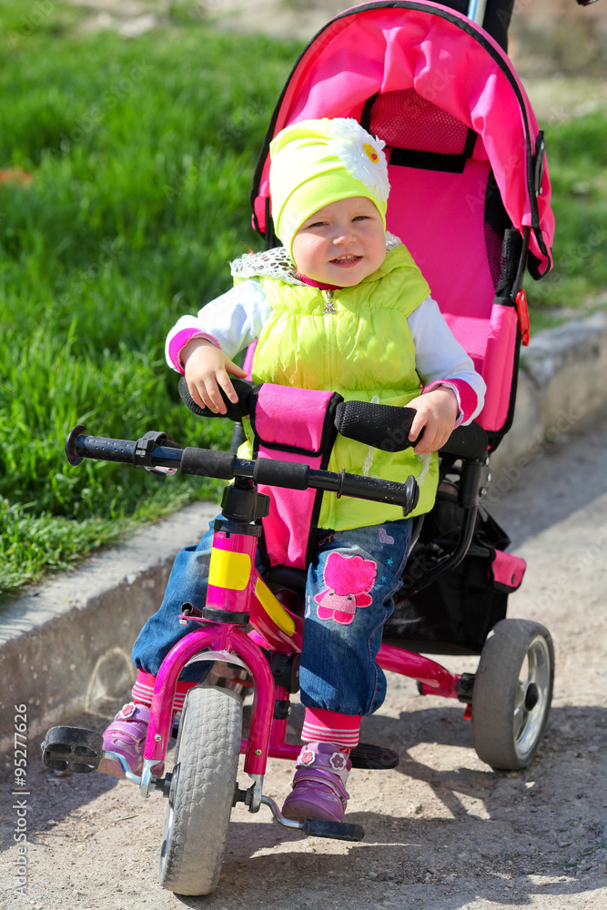 Little funny girl learning to ride a bike Little funny girl learning to ride a bike