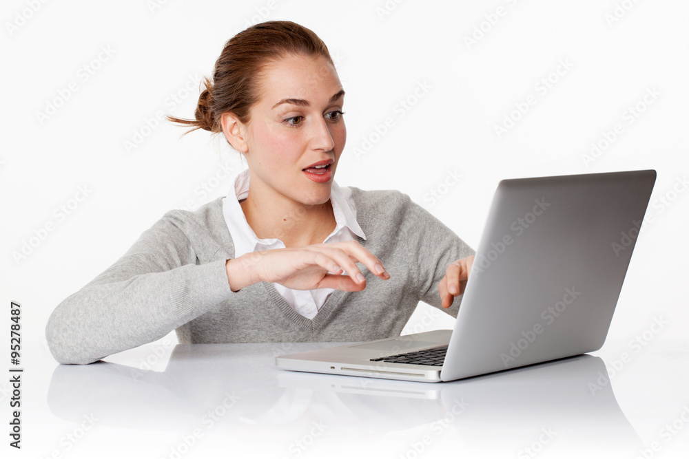 surprised 20s business girl or female student typing on pc surprised 20s business girl or female student typing on pc