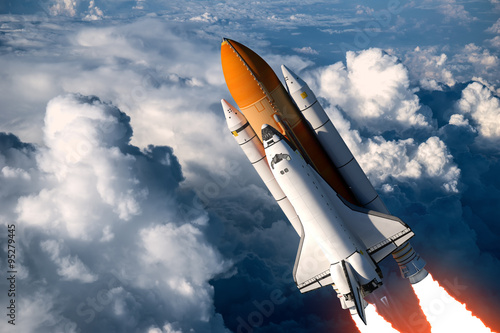 Fototapeta Naklejka Na Ścianę i Meble -  Space Shuttle Launch In The Clouds
