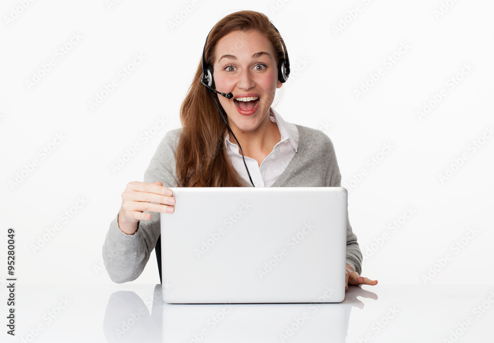 excited 20s professional with headset and computer in white office excited 20s professional with headset and computer in white office