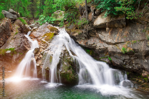 falls of a little river in the mountain of italy photo