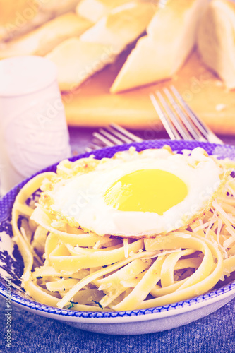 Pasta with crispy eggs photo