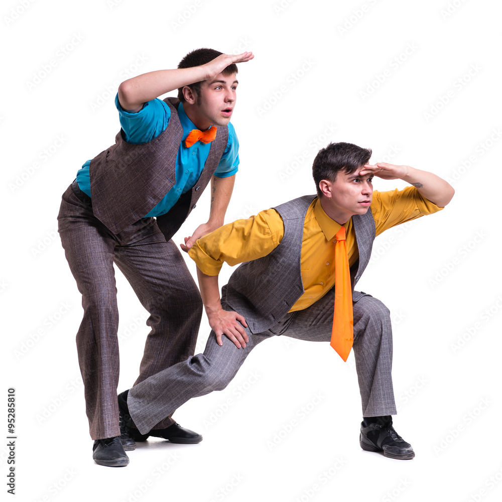 Disco dancers showing some movements against isolated white Disco dancers showing some movements against isolated white
