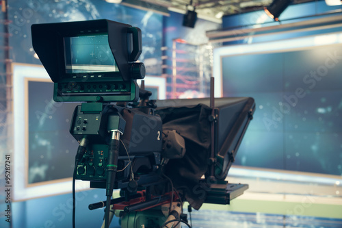 Television studio with camera and lights - recording TV NEWS