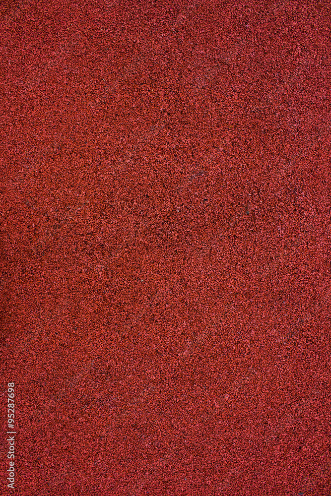 Fototapeta premium Pattern of the red runnig track or playground, background, texture