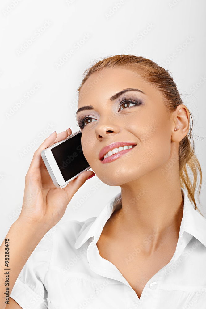Shot of an attractive young businesswoman using a mobile phone.Beautiful woman Shot of an attractive young businesswoman using a mobile phone.Beautiful woman