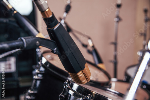 Studio microphone and drums. © bojan656