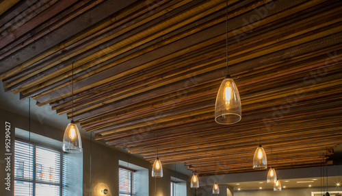 Interior of restaurant. Wooden design. Lighting and ceiling.