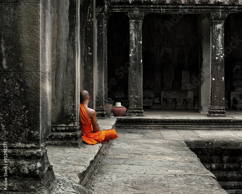 Photos A Buddhist Monk peacefully meditates in the Angkor Wat temple in Siem Reap Cambodia