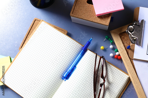 Desk of an artist with lots of stationery objects