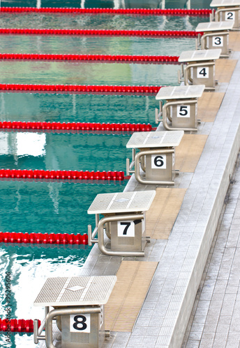 Empty swimming pool with starting block.