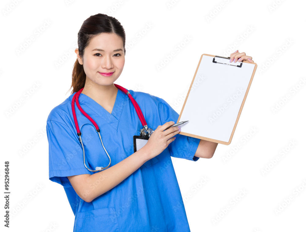 Young doctor pen point to clipboard Young doctor pen point to clipboard