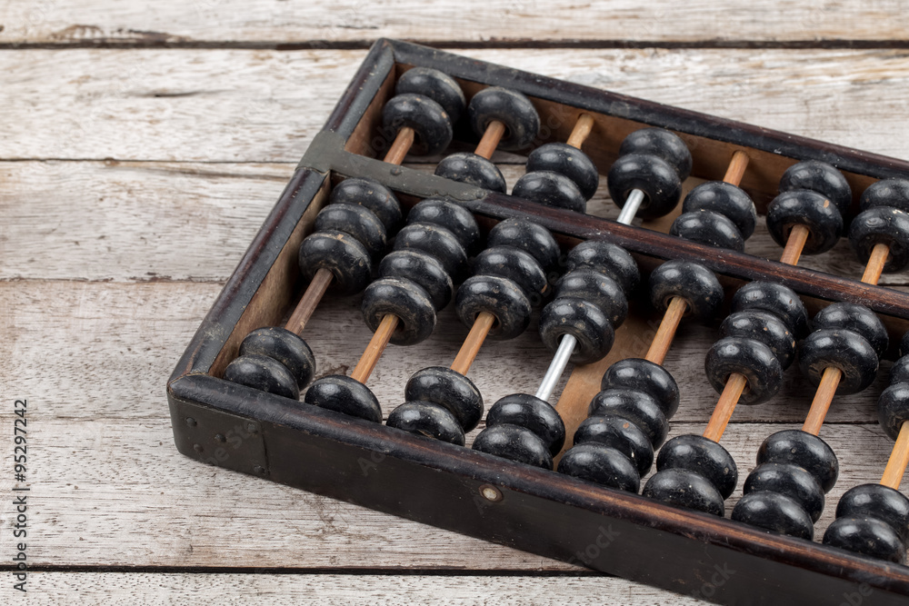 Old abacus on wooden background Old abacus on wooden background