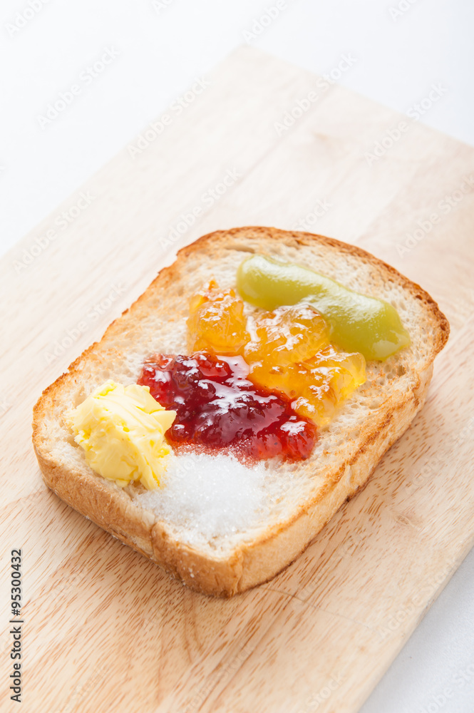 sliced bread with jam on wood background sliced bread with jam on wood background