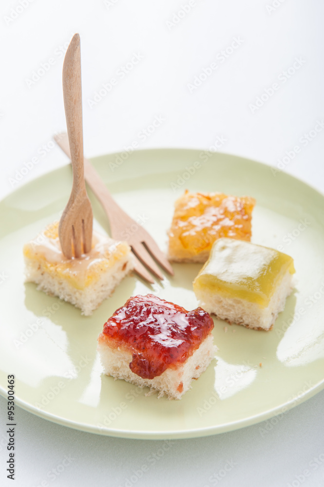 Mix fruit, blueberry, orange fruit jam spread on bread toast ove Mix fruit, blueberry, orange fruit jam spread on bread toast ove