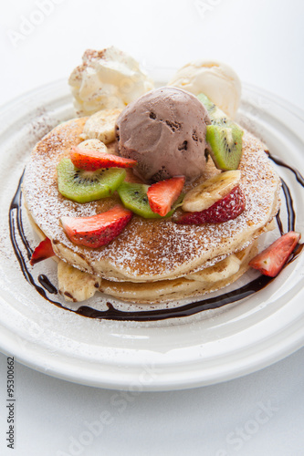 The Original pancakes with banana,ice cream and whipped cream on