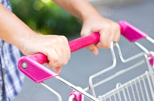 Close up of Asian man with shoppig cart. photo