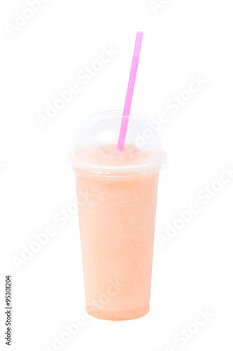 Fruit juice in plastic glass isolated on white.