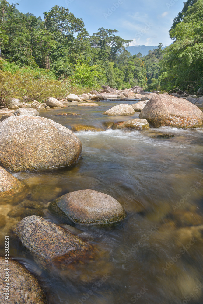 Un-focus image of Brook and rocks in the mountains at Kiriwong v Un-focus image of Brook and rocks in the mountains at Kiriwong v