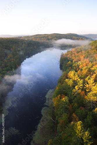 An aerial view of a hot air balloon floating over the Vermont country side .. © Chee-Onn Leong