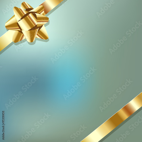 Gold ribbon on a blue bokeh fog background.