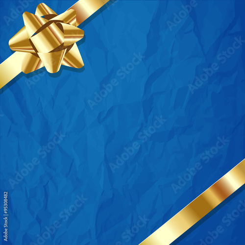 Gold ribbon on a crumpled paper blue background.