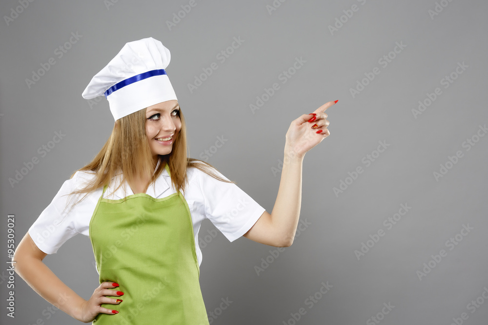 caucasian young woman chef pointing direction caucasian young woman chef pointing direction